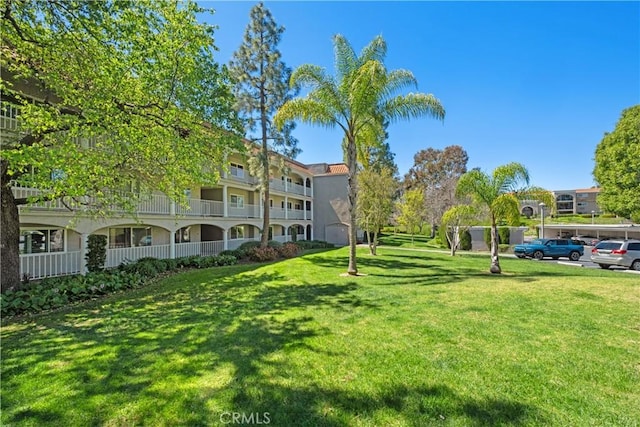 surrounding community featuring a lawn