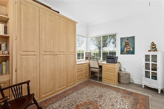 home office with ornamental molding and baseboards