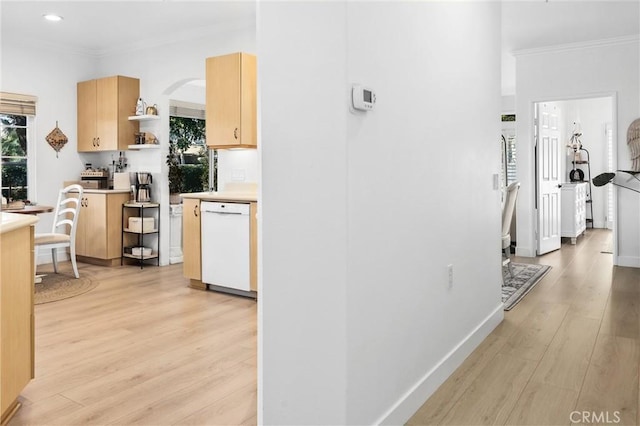 interior space featuring light wood-style floors, baseboards, and crown molding