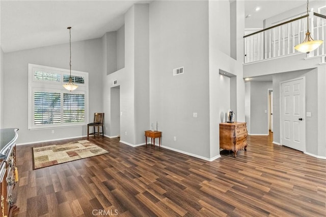 interior space featuring visible vents, baseboards, and wood finished floors