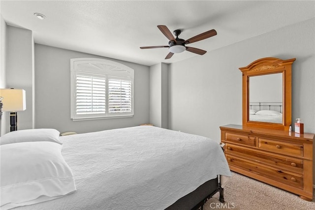 bedroom featuring carpet flooring and a ceiling fan