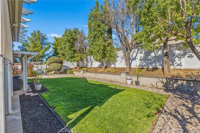 view of yard with a fenced backyard