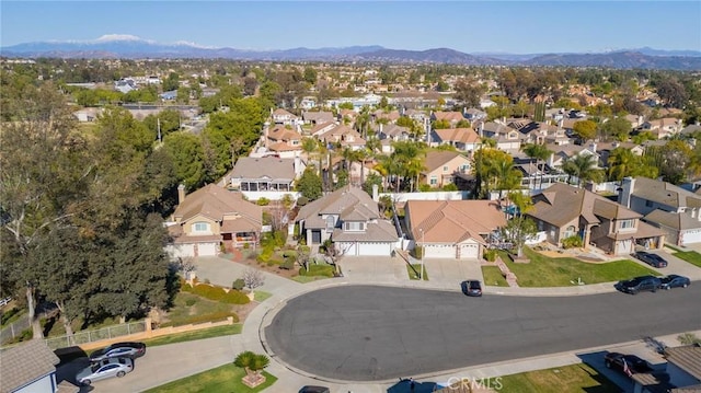 drone / aerial view with a mountain view and a residential view