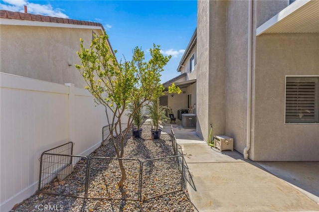 view of yard with a patio, cooling unit, and a fenced backyard