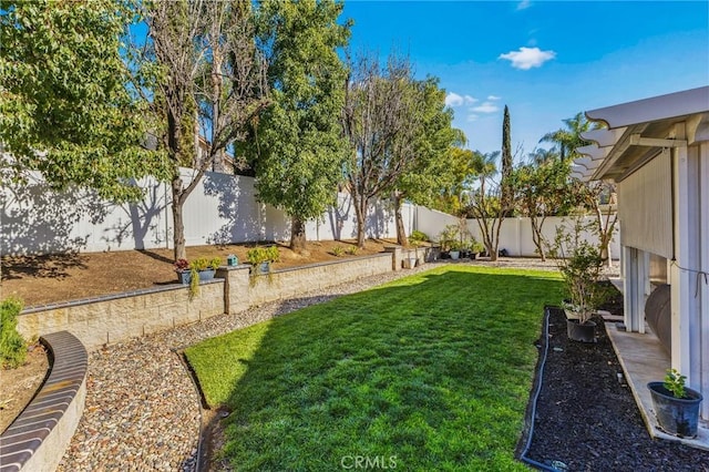 view of yard featuring a fenced backyard