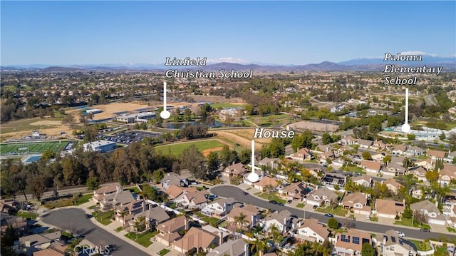 birds eye view of property featuring a residential view and a mountain view