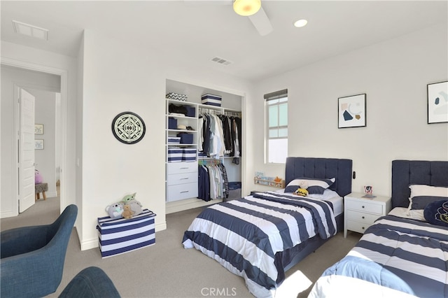 carpeted bedroom with a ceiling fan, recessed lighting, a closet, and visible vents