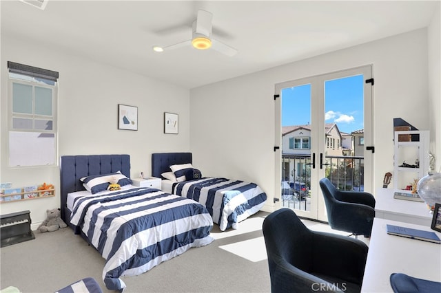 carpeted bedroom with access to exterior, french doors, and a ceiling fan