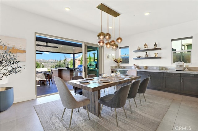 dining space featuring recessed lighting, plenty of natural light, and light tile patterned floors