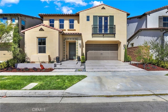 mediterranean / spanish house with concrete driveway, a balcony, a tiled roof, an attached garage, and stucco siding