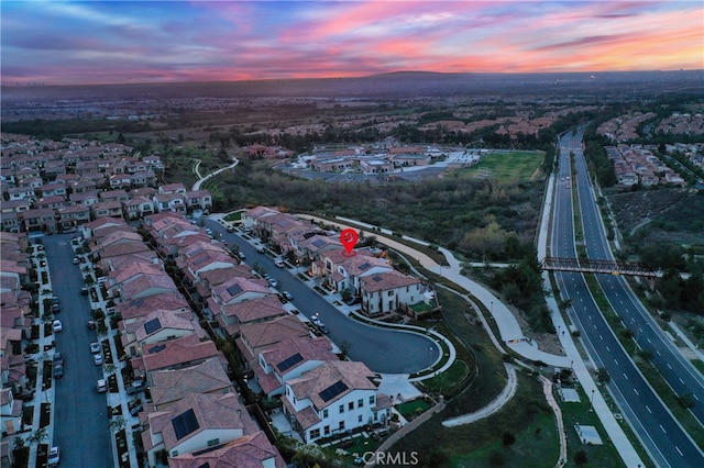 aerial view at dusk with a residential view