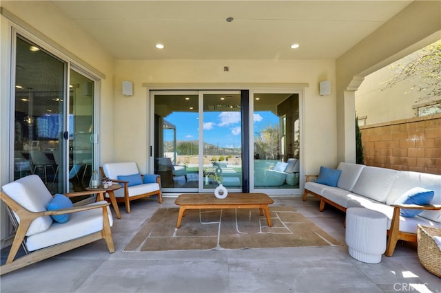 view of patio / terrace with outdoor lounge area and fence