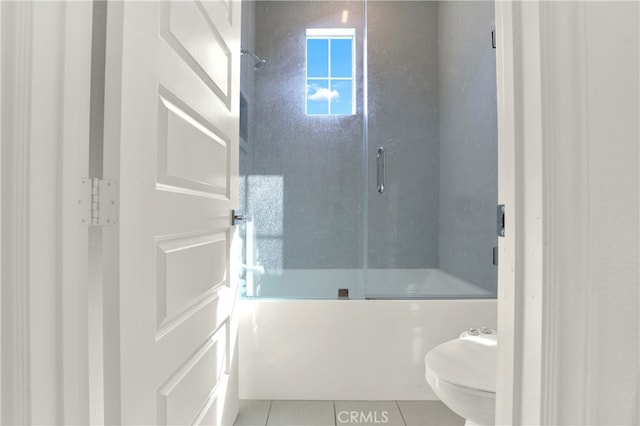 full bathroom with tile patterned flooring and toilet