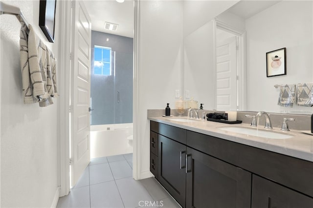 full bath with double vanity, tile patterned flooring, a sink, and visible vents