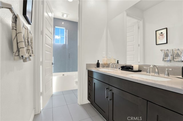 full bathroom with tile patterned flooring, double vanity, visible vents, and a sink