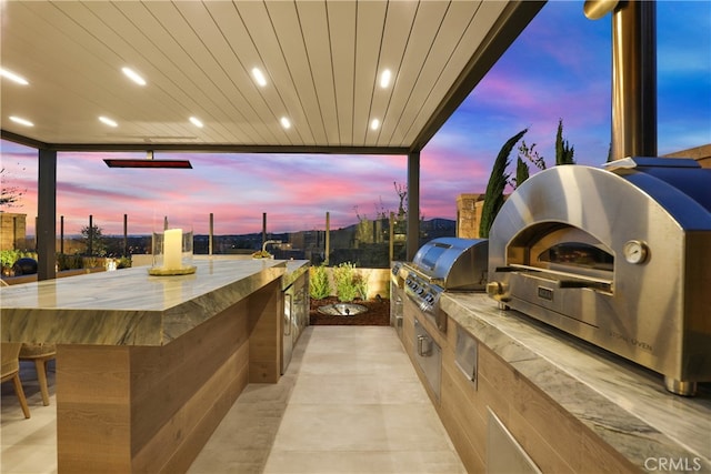 view of patio / terrace featuring exterior kitchen and area for grilling