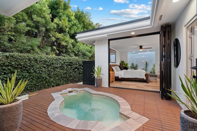 view of swimming pool with an outdoor hangout area, a deck, and an in ground hot tub