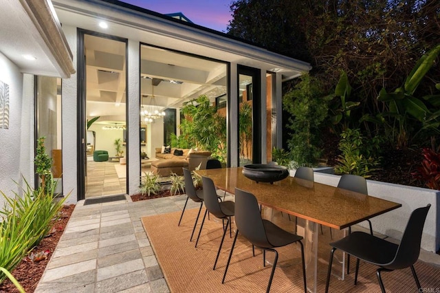 view of patio terrace at dusk