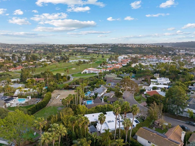 bird's eye view with view of golf course and a residential view