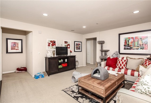 living room with recessed lighting, light carpet, and baseboards