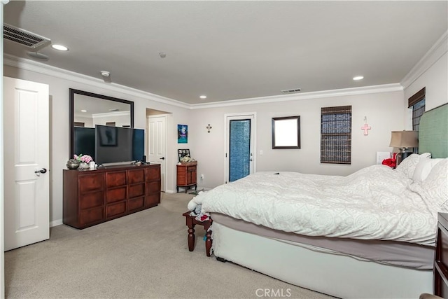 bedroom with carpet floors, visible vents, and ornamental molding