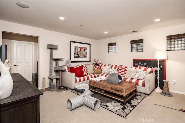 carpeted living room with baseboards, visible vents, and recessed lighting