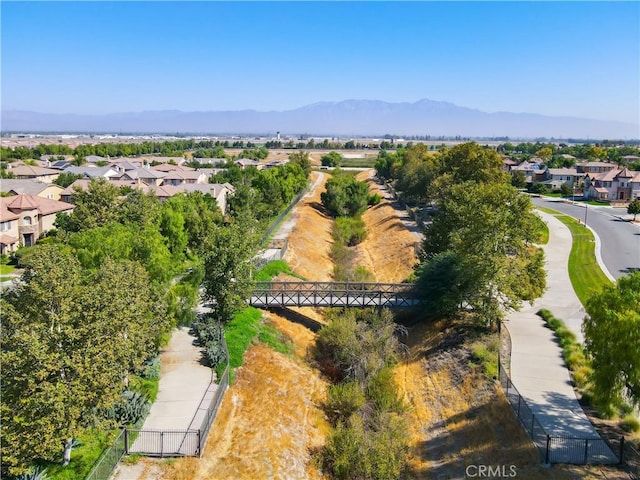 birds eye view of property with a mountain view and a residential view