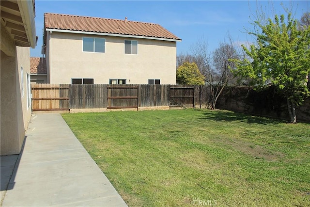 view of yard with a fenced backyard