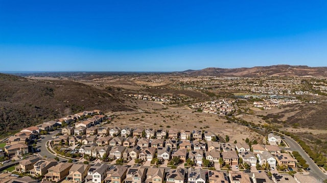 birds eye view of property with a mountain view and a residential view