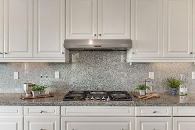 kitchen with backsplash, stainless steel gas cooktop, and under cabinet range hood