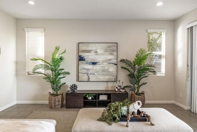 interior space featuring baseboards and recessed lighting