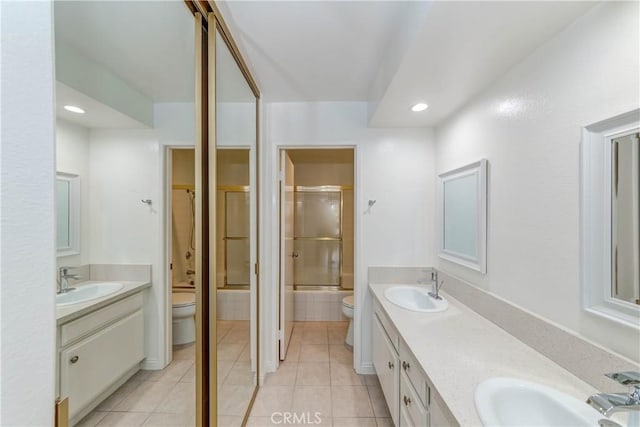 full bathroom with a sink, toilet, and tile patterned floors