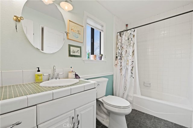 full bathroom with shower / tub combo, vanity, and toilet