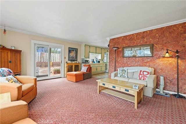 living area with ornamental molding, carpet, and baseboards