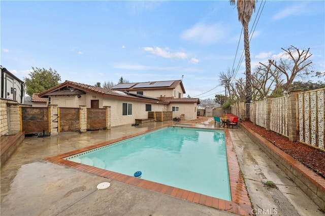 view of swimming pool with a fenced in pool, a fenced backyard, and a patio