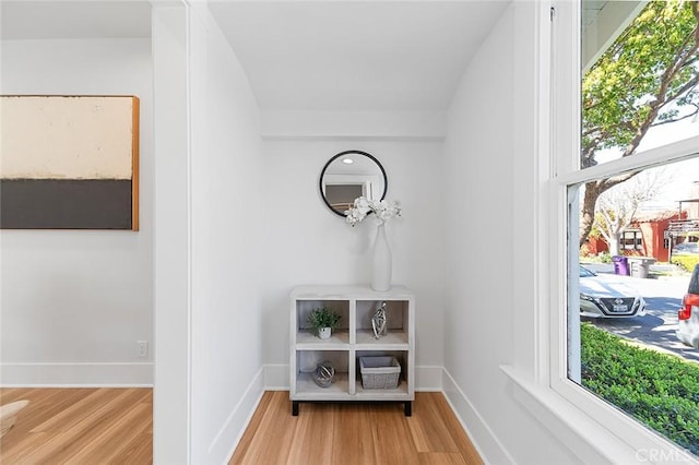 room details with baseboards and wood finished floors