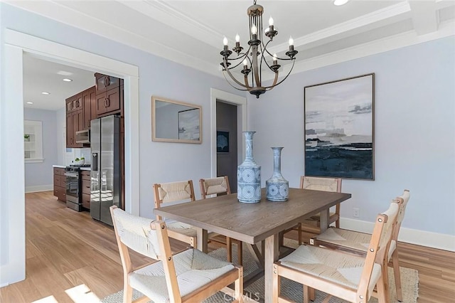 dining room with light wood-style floors, baseboards, an inviting chandelier, and recessed lighting