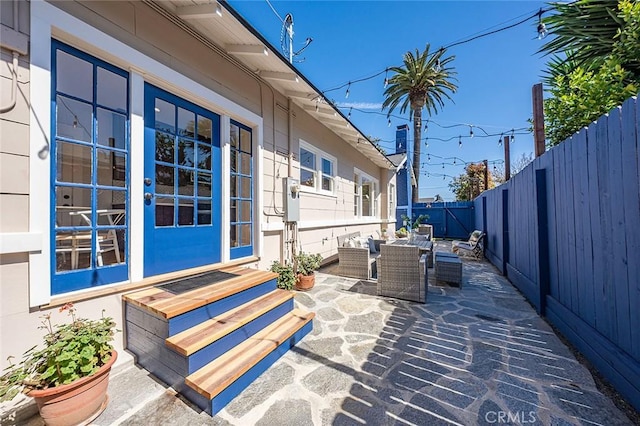 view of patio / terrace with entry steps and a fenced backyard