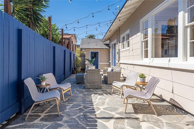 view of patio / terrace with a fenced backyard and an outdoor living space