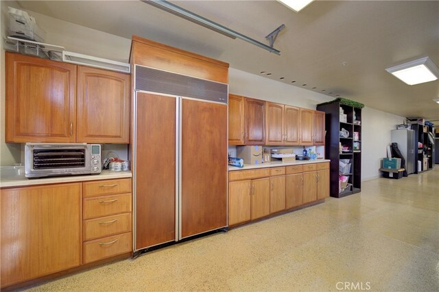 515 Windermere Ln, Arroyo Grande, CA 93420 - kitchen featuring built in refrigerator, light countertops, and brown cabinets