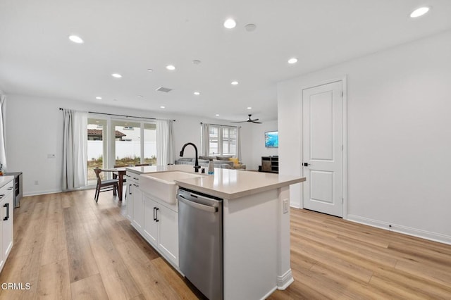 kitchen with recessed lighting, white cabinetry, a sink, light wood-type flooring, and dishwasher