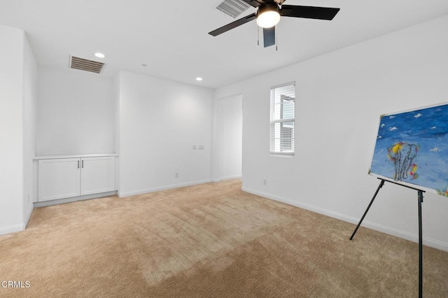 carpeted empty room featuring baseboards, visible vents, ceiling fan, and recessed lighting