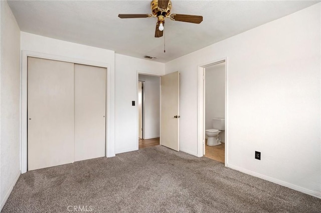 unfurnished bedroom featuring ensuite bathroom, ceiling fan, carpet flooring, visible vents, and a closet