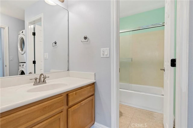 3535 Madison Ave, Unit San Diego, CA 92116 - bathroom with stacked washer / dryer, tile patterned flooring, vanity, and shower / washtub combination