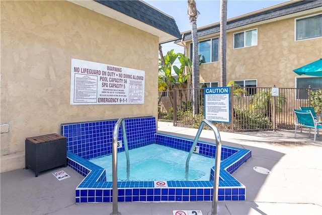 3535 Madison Ave, Unit San Diego, CA 92116 - view of swimming pool featuring fence and a hot tub