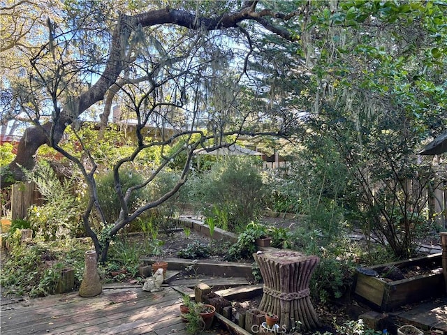 exterior space featuring fence and a wooden deck