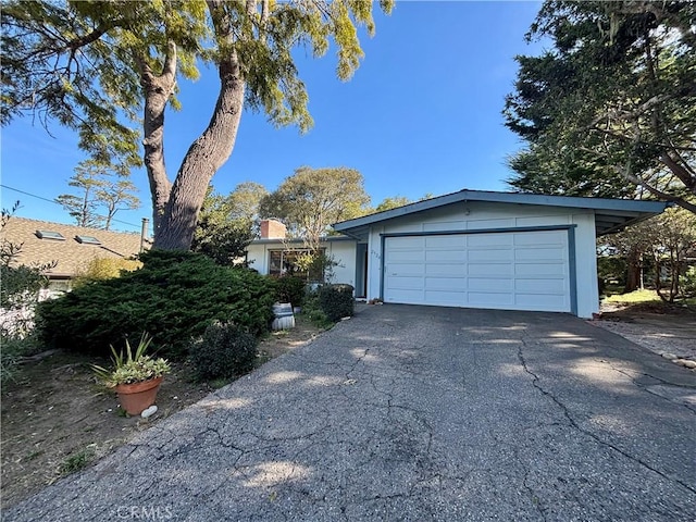 exterior space with driveway and a garage