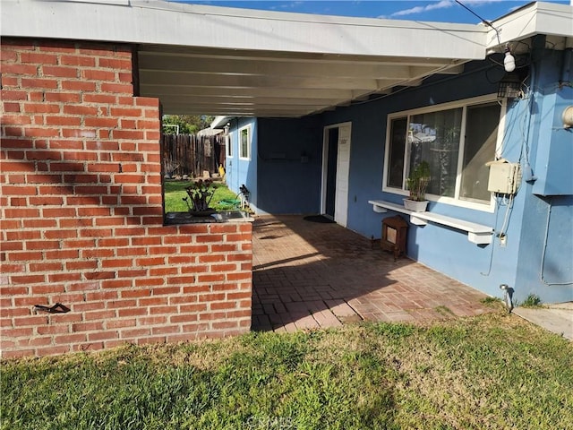 view of patio featuring fence