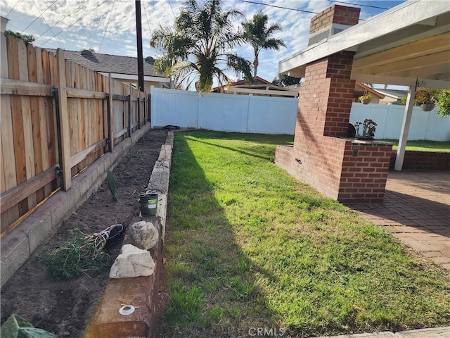 view of yard with a fenced backyard