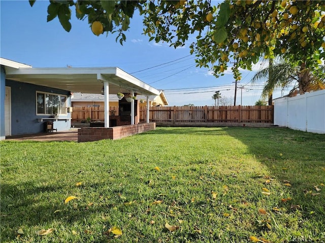 view of yard featuring a patio area and a fenced backyard